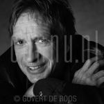 22-06-2006 Alex Roeka at studio in Amsterdam.

[keywords]Black & White Image, Headshot, Eyecontact, Smiling, Guitar, Singer[/keywords]